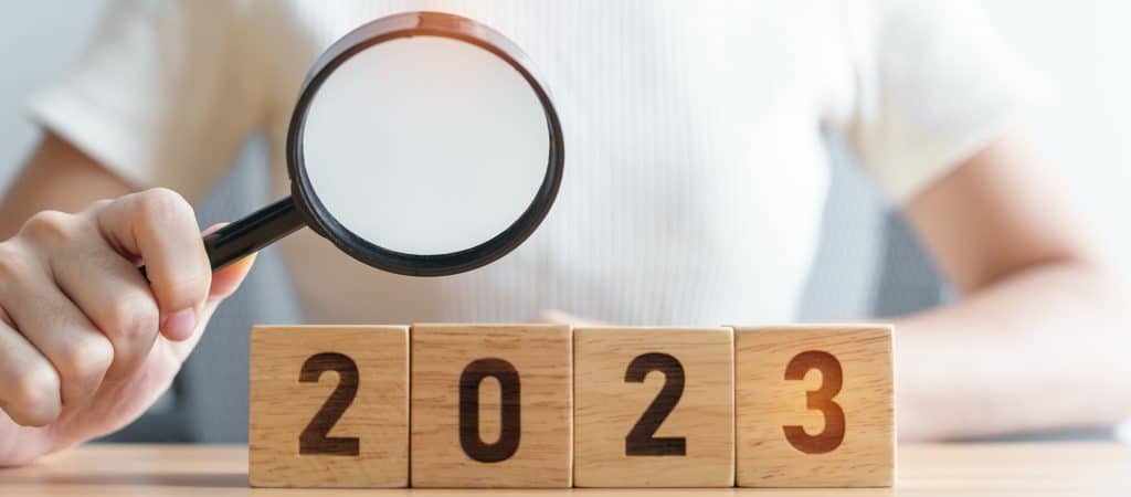 2023 block with magnifying glass